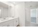 Modern bathroom features dual vanity sinks, tile floors, and access to shower at 2949 Wild Olive Dr, St Cloud, FL 34772