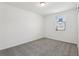 Well-lit bedroom with carpet and window overlooking exterior at 2949 Wild Olive Dr, St Cloud, FL 34772