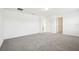 Well-lit bedroom featuring plush carpeting, and a door that leads into the walk-in closet at 2949 Wild Olive Dr, St Cloud, FL 34772