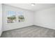 Bright, carpeted bedroom with plenty of natural light from the large windows at 2949 Wild Olive Dr, St Cloud, FL 34772