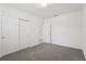 Bedroom featuring carpet, closet, and entry to bathroom and stairs at 2949 Wild Olive Dr, St Cloud, FL 34772