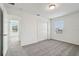 Bedroom with a large window, closet, and a door leading to another room at 2949 Wild Olive Dr, St Cloud, FL 34772