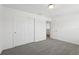 Spacious bedroom with a closet and neutral carpeting is bathed in natural light at 2949 Wild Olive Dr, St Cloud, FL 34772
