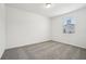 Empty bedroom with soft carpet, a window and neutral walls, ready for personal touches at 2949 Wild Olive Dr, St Cloud, FL 34772