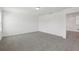 Spacious, carpeted bedroom area perfect for relaxing with modern lighting and neutral decor at 2949 Wild Olive Dr, St Cloud, FL 34772