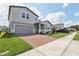 Attractive home with well-kept lawn, brick driveway, and two-car garage at 2949 Wild Olive Dr, St Cloud, FL 34772