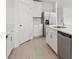 Bright kitchen boasts all-white cabinets, stainless appliances, an island with sink and plenty of counter seating at 2949 Wild Olive Dr, St Cloud, FL 34772