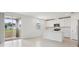 Modern kitchen with white cabinets, stainless steel appliances, and a center island at 2949 Wild Olive Dr, St Cloud, FL 34772