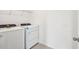 Modern laundry room featuring a new washer and dryer, and built-in shelving at 2949 Wild Olive Dr, St Cloud, FL 34772