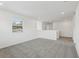 Bright, carpeted living area with a window, perfect for relaxing or entertaining in a modern home at 2949 Wild Olive Dr, St Cloud, FL 34772