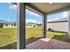 Open patio with brick pavers, providing an outdoor living space overlooking the lawn at 2949 Wild Olive Dr, St Cloud, FL 34772