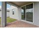 Covered patio featuring brick pavers and sliding glass door leading inside the residence at 2949 Wild Olive Dr, St Cloud, FL 34772