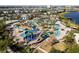 Community pool with waterslides and lounging areas at 3171 Paradox Cir # 305, Kissimmee, FL 34746