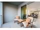 Relaxing balcony with seating for two, offering a view into the living room at 3171 Paradox Cir # 305, Kissimmee, FL 34746