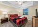 Comfortable bedroom with a queen-size bed and a flat-screen TV at 3171 Paradox Cir # 305, Kissimmee, FL 34746