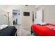 Bright bedroom with twin beds, closet, and a view of additional living space at 3171 Paradox Cir # 305, Kissimmee, FL 34746