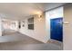 Building hallway with blue apartment door at 3171 Paradox Cir # 305, Kissimmee, FL 34746