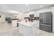 Modern kitchen with island and stainless steel appliances at 3171 Paradox Cir # 305, Kissimmee, FL 34746
