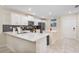 Modern kitchen with white cabinets and quartz countertops at 3171 Paradox Cir # 305, Kissimmee, FL 34746
