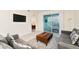 Living room with gray sectional sofa and balcony access at 3171 Paradox Cir # 305, Kissimmee, FL 34746
