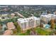 Aerial view of the property complex showcasing mature trees, ponds, and a swimming pool at 6336 Buford St # 705, Orlando, FL 32835