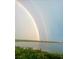 Stunning water view of a rainbow over the lake from the home at 6336 Buford St # 705, Orlando, FL 32835