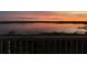 A peaceful water view at sunset with colorful, vivid skies from the balcony at 6336 Buford St # 705, Orlando, FL 32835