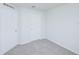 Freshly painted bedroom with neutral carpet and white trim at 1123 Union Ave, Mascotte, FL 34753