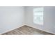 Modern bedroom featuring durable floors, white trim, and a bright window at 1123 Union Ave, Mascotte, FL 34753