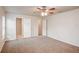 Spacious bedroom featuring plush carpet, a ceiling fan, and bright natural light at 1123 Union Ave, Mascotte, FL 34753