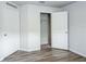 Bright bedroom featuring durable floors and a closet at 1123 Union Ave, Mascotte, FL 34753