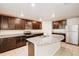 Modern kitchen with stainless steel appliances and a spacious center island at 1123 Union Ave, Mascotte, FL 34753
