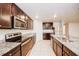 Well-equipped kitchen with granite countertops and stainless steel appliances at 1123 Union Ave, Mascotte, FL 34753