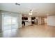 Open-concept living room featuring tile floors and a view of the kitchen at 1123 Union Ave, Mascotte, FL 34753