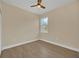 Well-lit bedroom with wood-look floors and a window at 139 Malauka Pass, Ocklawaha, FL 32179