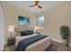 Comfortable bedroom featuring a large window for natural light at 139 Malauka Pass, Ocklawaha, FL 32179