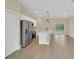 Modern kitchen with stainless steel appliances and an island at 139 Malauka Pass, Ocklawaha, FL 32179