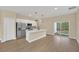 Modern kitchen with island and access to backyard at 139 Malauka Pass, Ocklawaha, FL 32179