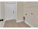 Functional laundry room equipped with essential hookups, a wire shelf and a durable white door at 139 Malauka Pass, Ocklawaha, FL 32179
