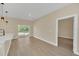 Spacious living room with hardwood floors and sliding glass door to backyard at 139 Malauka Pass, Ocklawaha, FL 32179