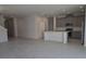 Open-concept living room with tile floors and views of the kitchen at 2059 Town Pasture Dr, Eustis, FL 32726