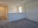 Loft area with neutral carpeting, perfect for a second living area or play area at 2059 Town Pasture Dr, Eustis, FL 32726