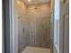 Bathroom with a tiled glass enclosed walk in shower with a shower wand and rain shower head at 2063 Town Pasture Dr, Eustis, FL 32726