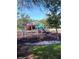 Community playground with play structures and soft surface at 428 Palastro Ave, Auburndale, FL 33823