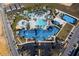 Aerial view of the resort's amenities, showing the pool, lazy river, playground, parking lot, and other recreational facilities at 4294 Lana Ave, Davenport, FL 33897