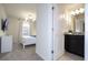 Stylish bathroom with a granite-topped vanity adjacent to a neutrally decorated bedroom at 4294 Lana Ave, Davenport, FL 33897