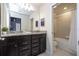 Bathroom features a double vanity with granite countertops and a bathtub shower combination at 4294 Lana Ave, Davenport, FL 33897