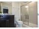 Bathroom featuring a sliding glass shower, granite countertop, and modern vanity at 4294 Lana Ave, Davenport, FL 33897