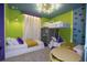 Colorful bedroom with bunk beds, climbing wall and ample natural light at 4294 Lana Ave, Davenport, FL 33897