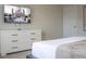 Cozy bedroom featuring a TV, dresser, and a comfortable bed with decorative pillows at 4294 Lana Ave, Davenport, FL 33897